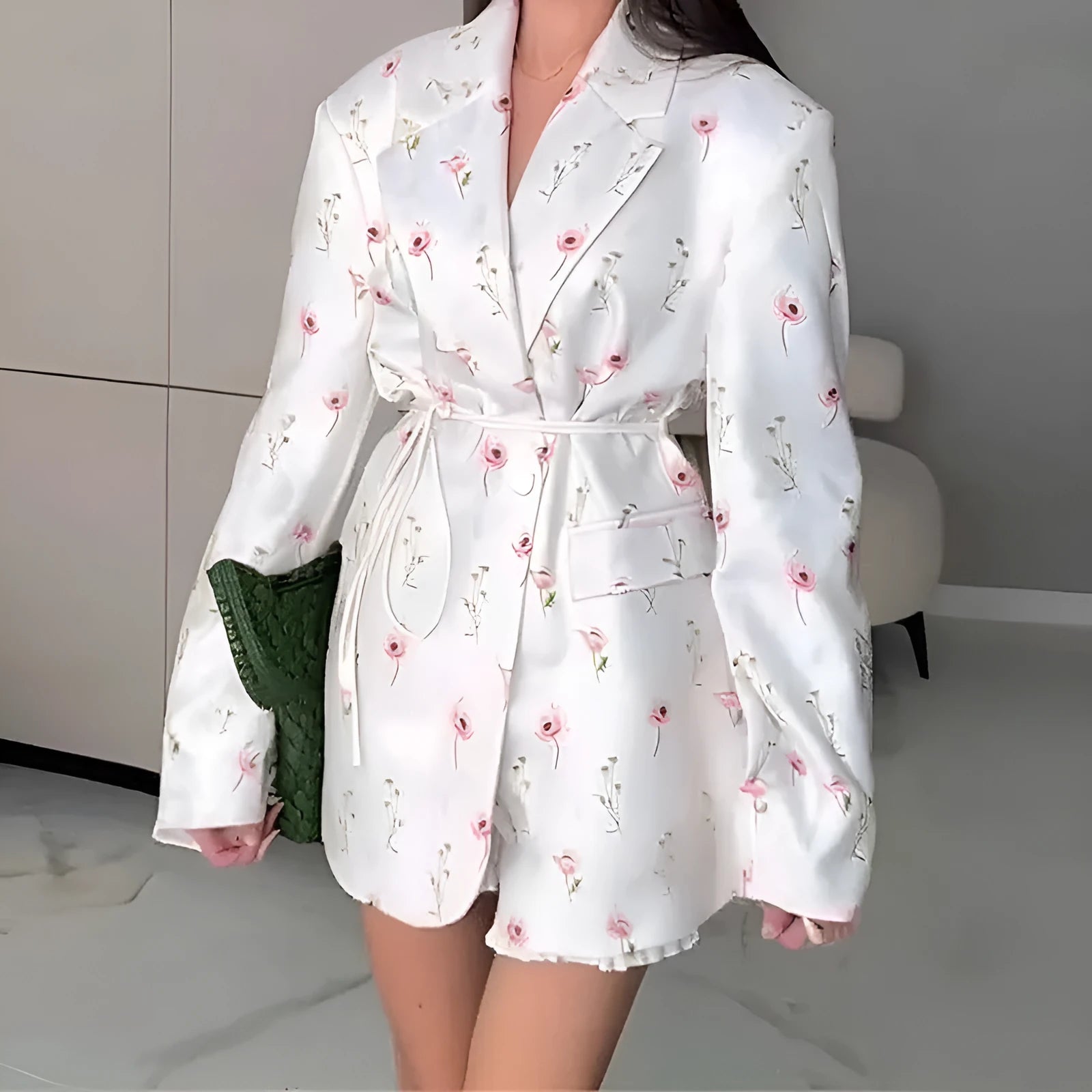 Women's printed polyester jacket with a lace-up collar detail, shown in a floral design.