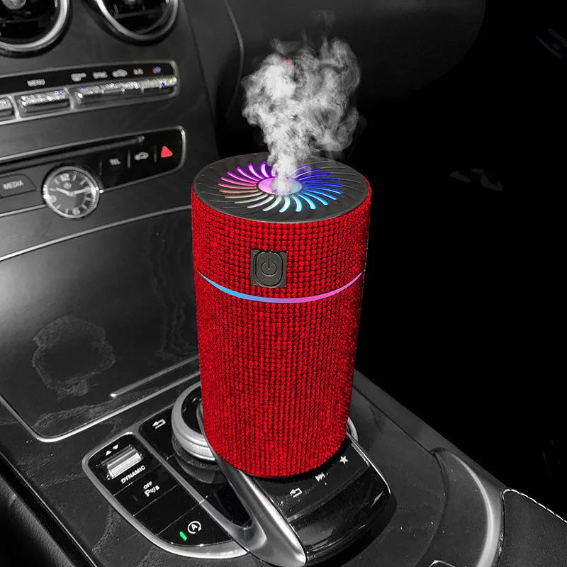 Compact white car air purifier humidifier with USB cord on car dashboard