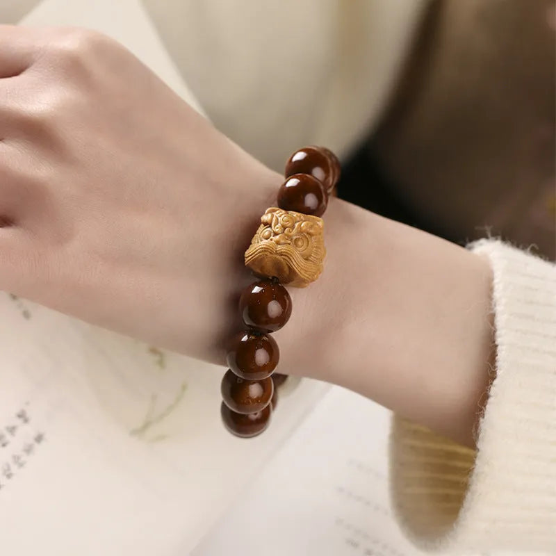 Hand-woven Buddhist prayer bracelet with 13mm round beads in ivory nut, bodhi, or sandalwood lion style