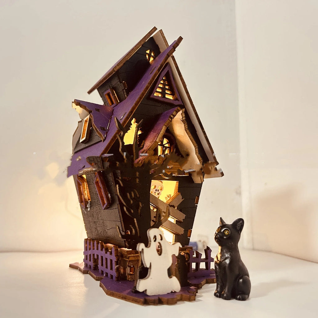 Wooden DIY glowing haunted house Halloween table decoration with luminous details