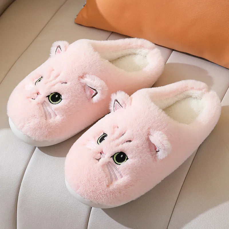 Cute cat plush slippers with non-slip EVA sole, thickened design, available in pink colour on a floor surface