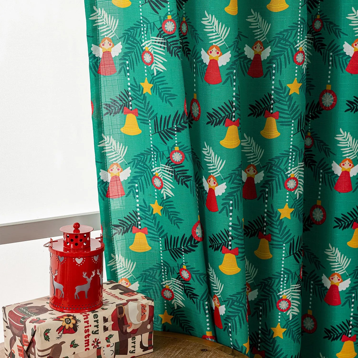 Green Christmas curtain with cartoon snowman and angel print, 1 metre wide.
