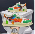 Simple lace-up fashion sneaker in Rainbow White Blue colour on a plain background.