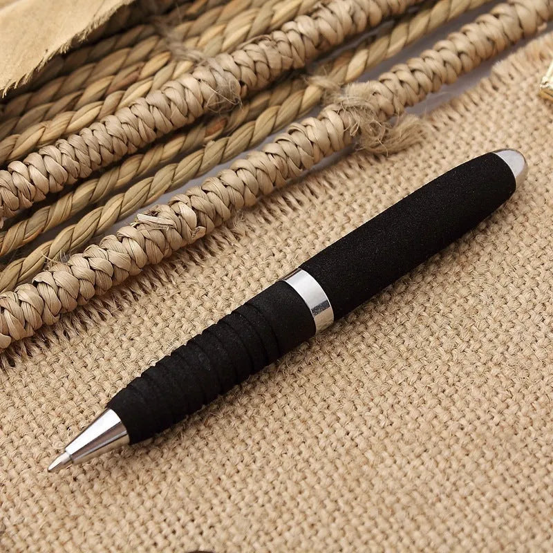 Compact silver and black ballpoint pen with a 1.0mm metal tip and a textured EVA cap.