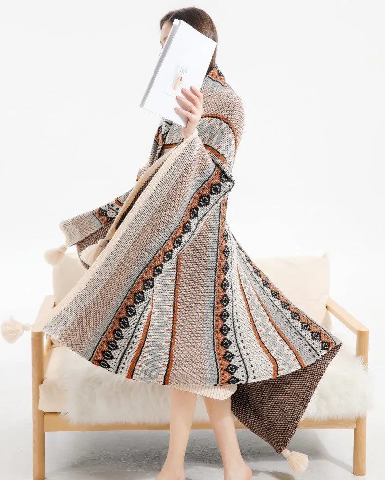 Bohemian style acrylic sofa cover blanket with tassel trim in a geometric pattern colour option.