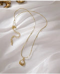 Golden freshwater pearl necklace with titanium steel element in a retro baroque style, single necklace