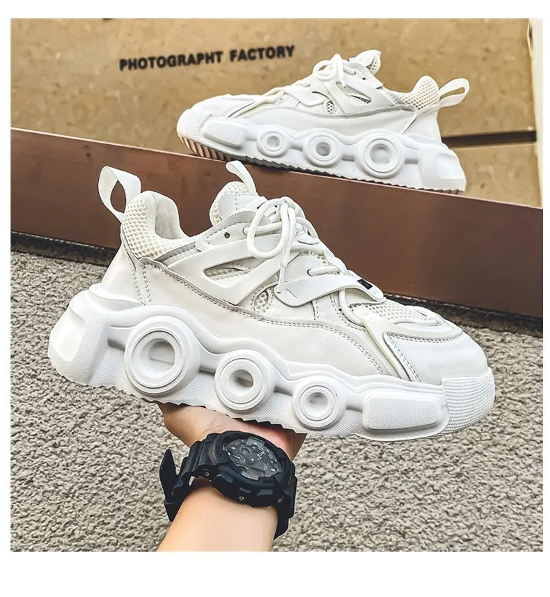 Men's low-top sneaker in grey with breathable mesh upper, thick rubber sole, round toe, and lace-up front.