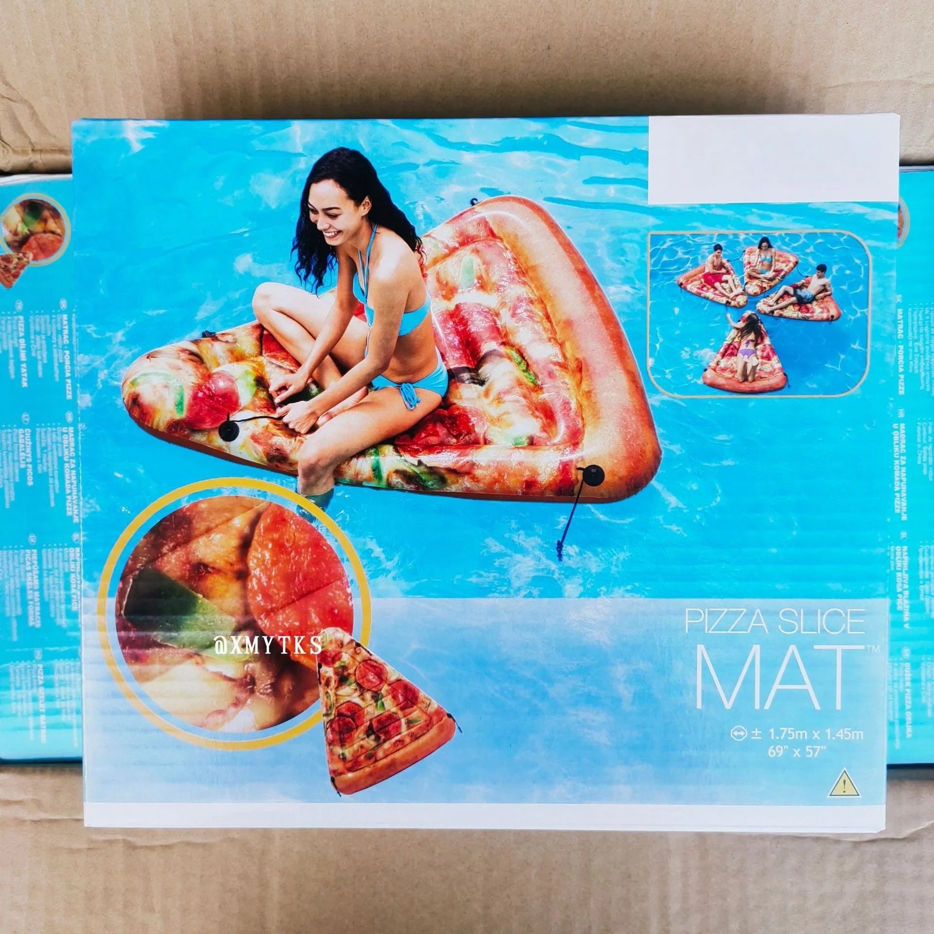 Large green pizza-shaped inflatable surfboard lounger floating on water
