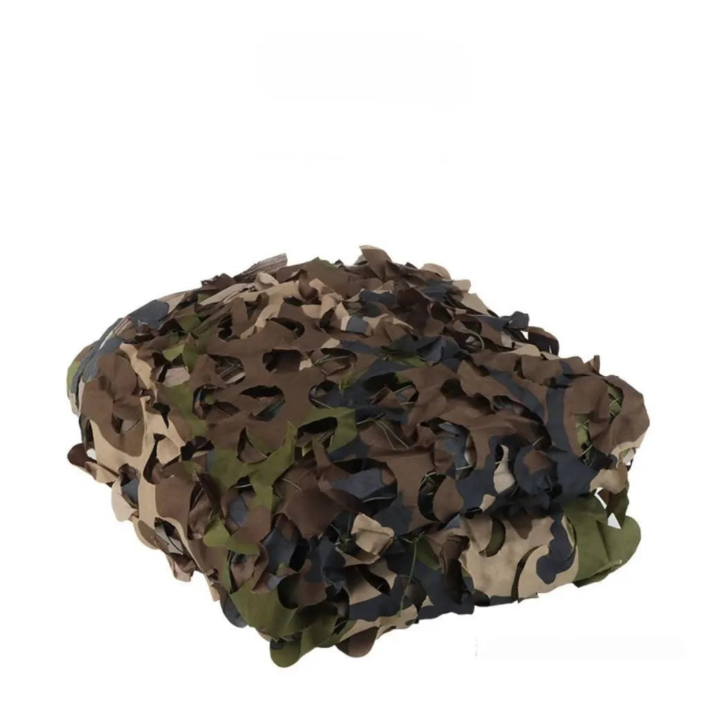 Green camouflage net set on grass showing textured pattern for sunshade and concealment.