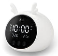 Smart alarm clock with silicone shell, luminous display, and power cord, shown in various style options.