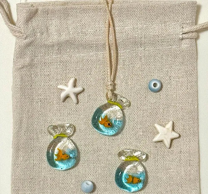 Women's coloured glaze pendant necklace on a beige cotton-linen cord, showing Skirt and Joker design details.