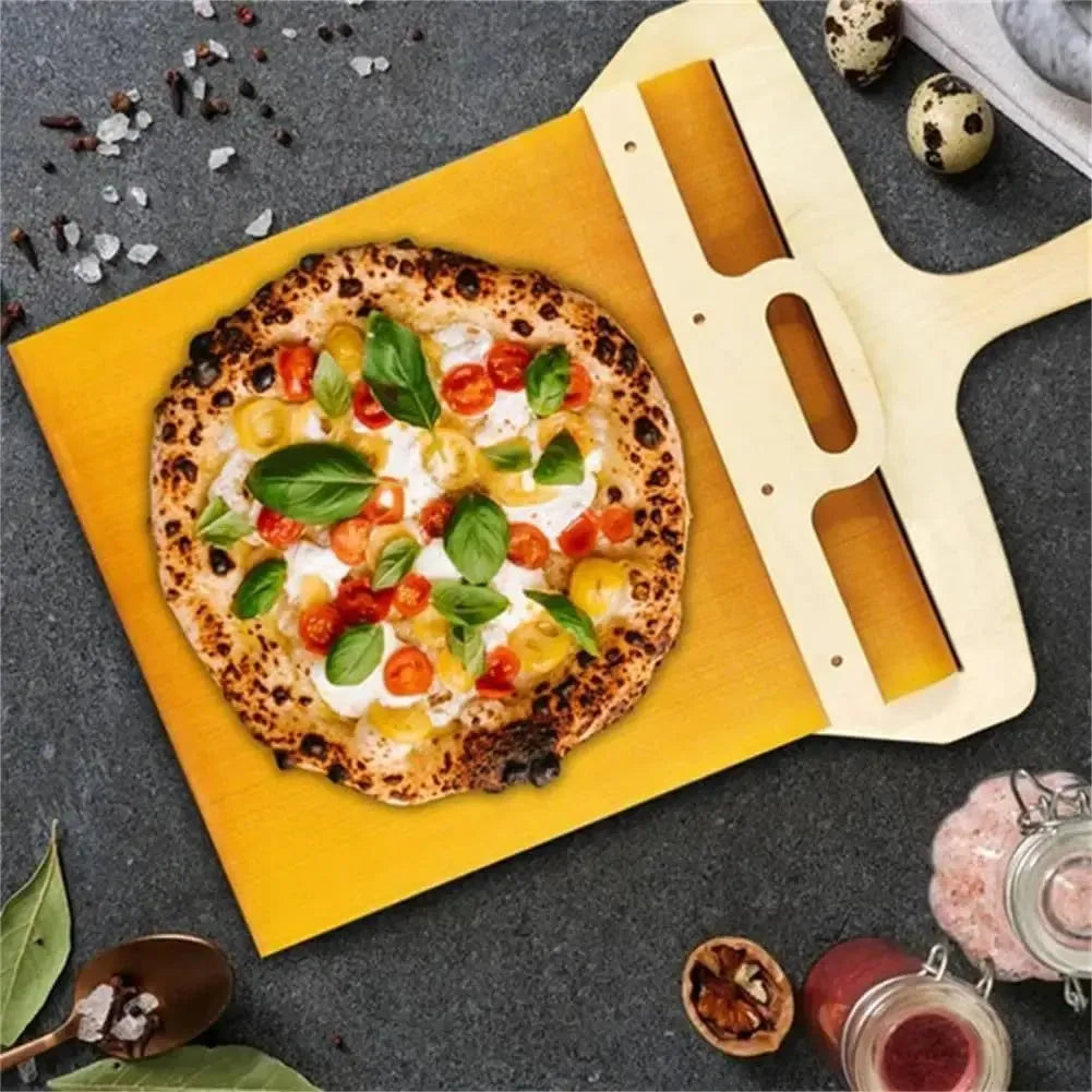 Wooden pizza shovel with cutting board surface and hanging hole at handle