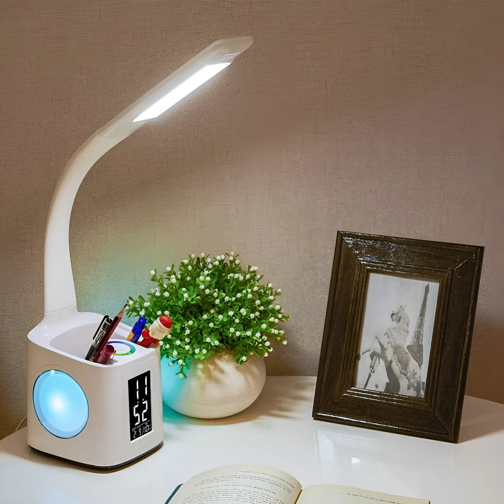 White 7-in-1 LED desk lamp with USB port, LCD screen, calendar, pen holder and colour night light base