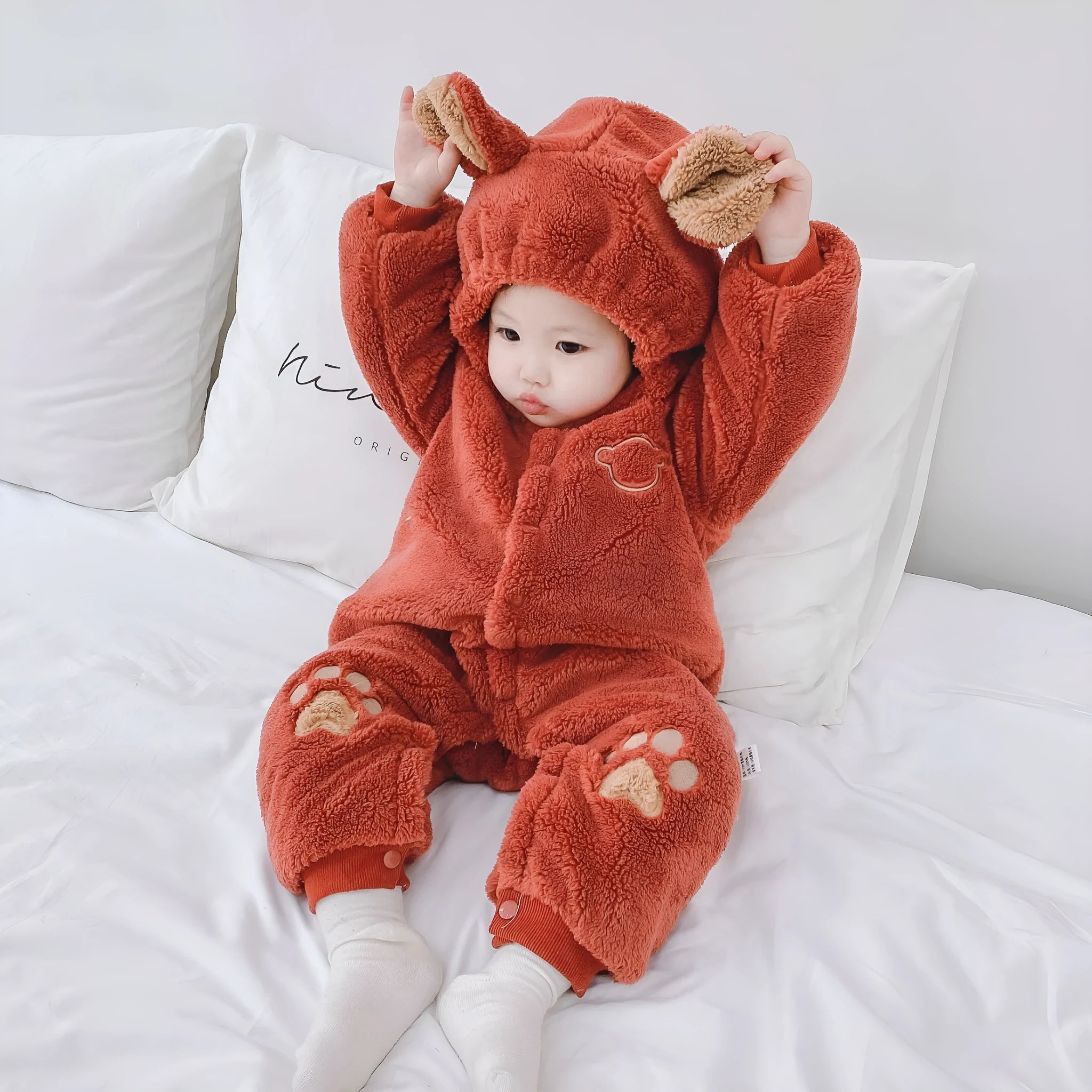 Newborn baby quilted rice velvet onesie in neutral colour with long sleeves, flat car stitching, 0-2 years size range