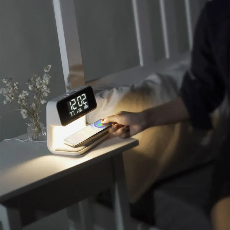 White 3-in-1 bedside lamp with wireless charging pad, LCD clock display, and touch controls.
