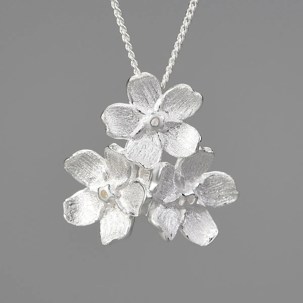 Myosotis Sylvatica sterling silver flower pendant with electroplated gold or silver finish, hand-designed pastoral jewellery