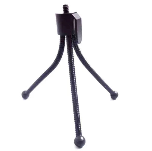 Small black iron mini tripod with ball head, shown folded to 110mm next to a smartphone.