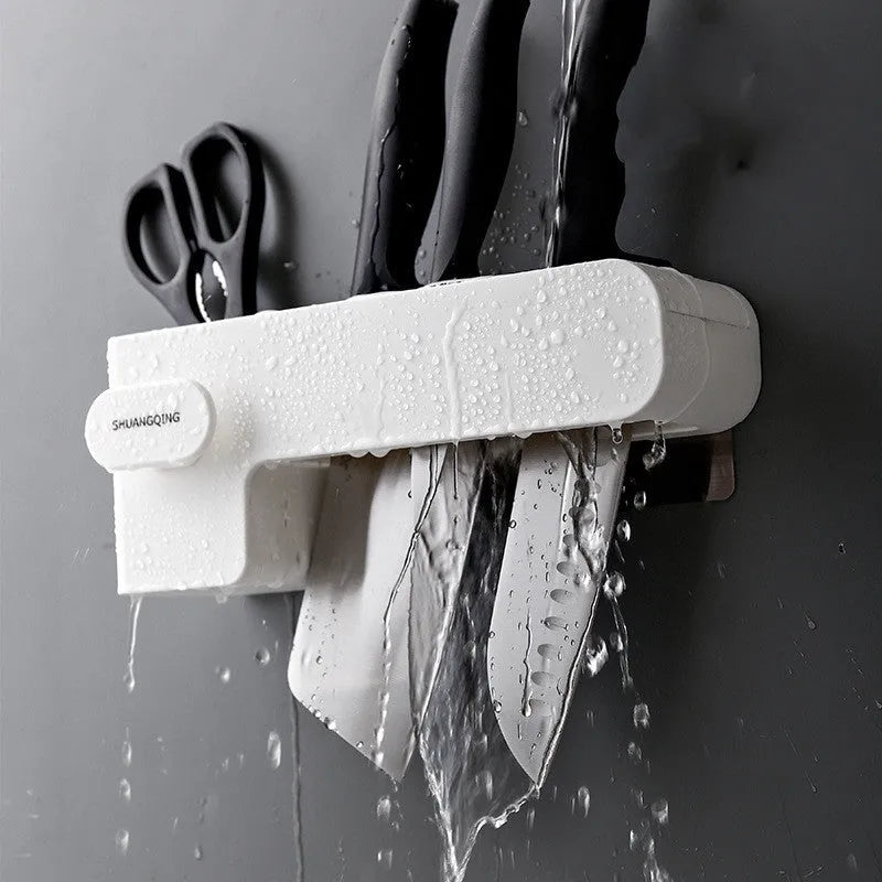 Modern white plastic kitchen knife storage rack with seven slots for organising cutlery