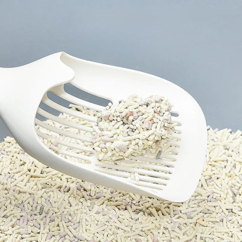 Large white plastic cat litter shovel with slotted drainage holes on a 22cm wide scoop