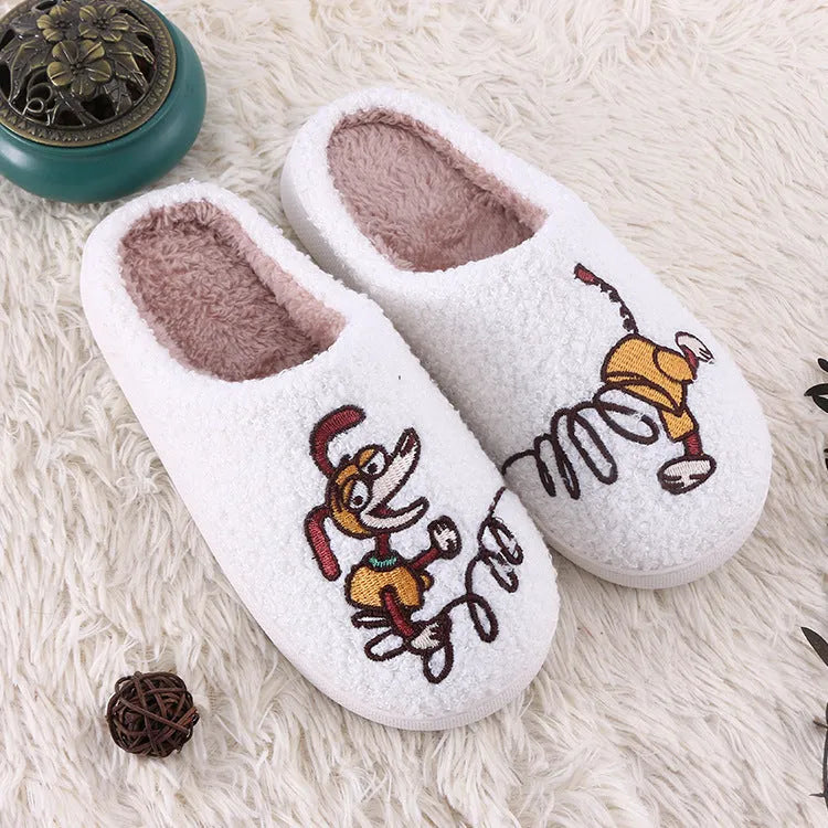 White adult fluffy slippers with cartoon pattern, rubber sole, and plush upper.