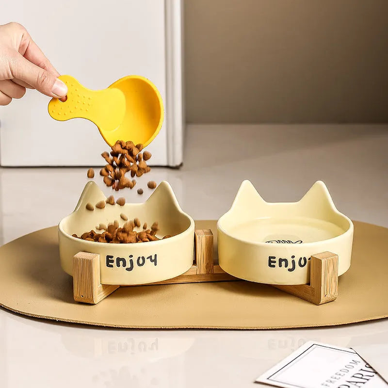 Porcelain cat bowl with wooden anti-tumble frame in cat ear design
