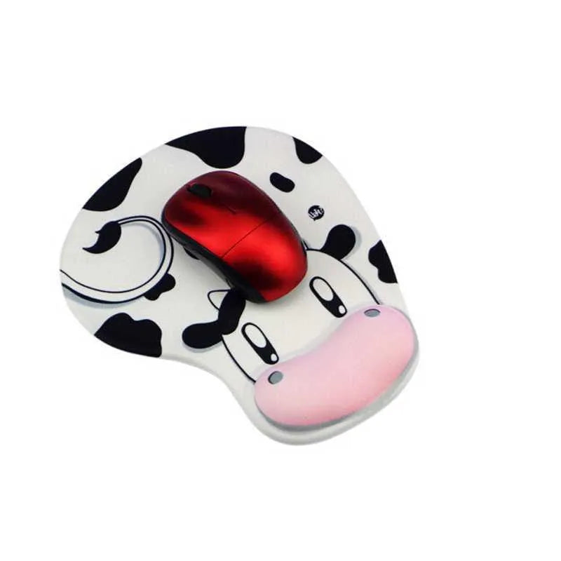 Super soft silicone cow pattern wrist rest mouse pad on a desk, showing non-slip base and ergonomic hand support.