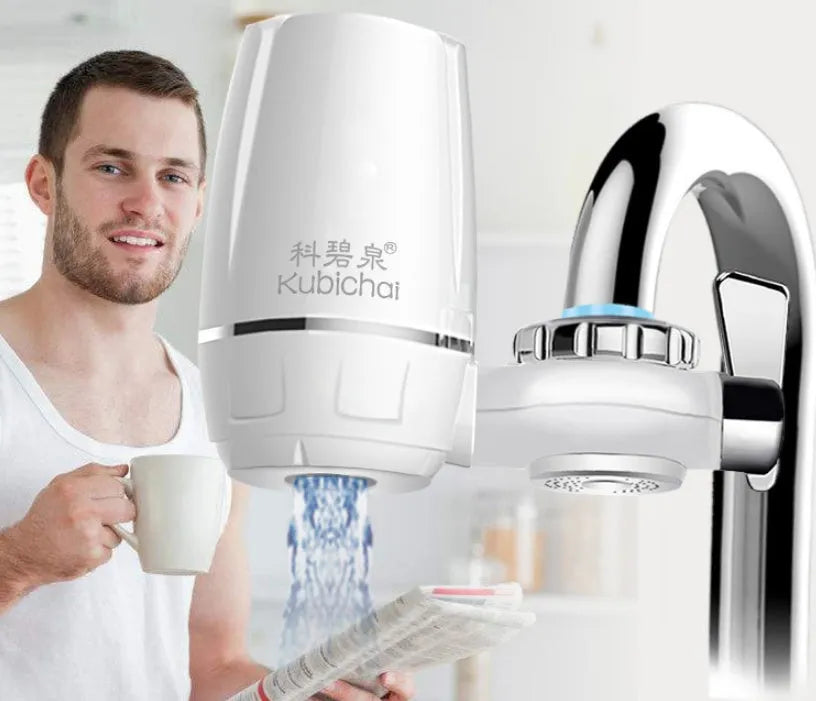 White plastic faucet water filter unit with adapters and ceramic cartridge for kitchen tap installation.