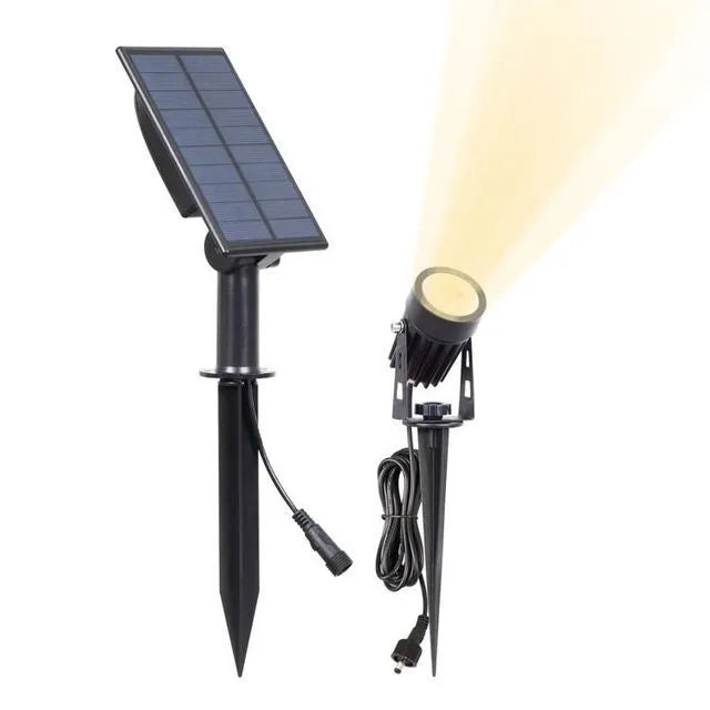 Solar lawn lamp with aluminium frame and white LED panel on grass