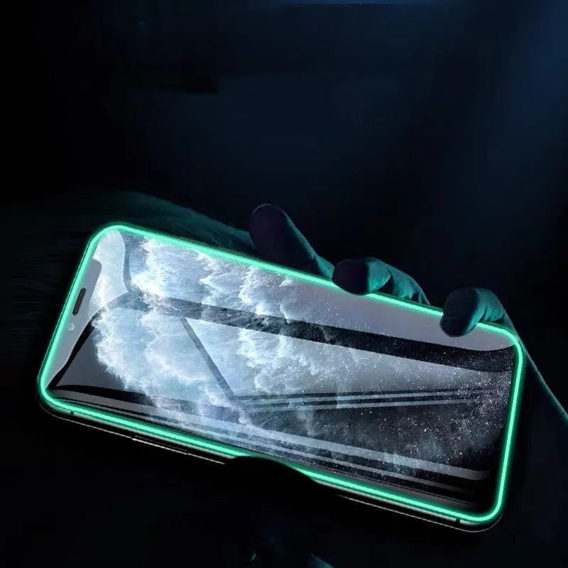 Luminous full cover tempered glass screen protector glowing softly next to an iPhone.