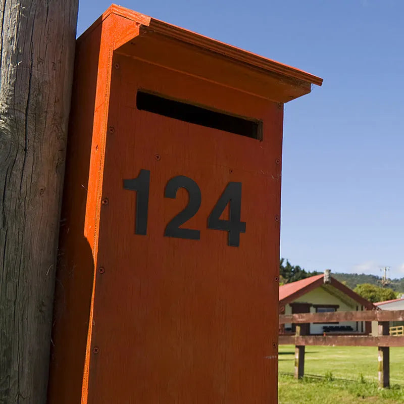 Black stainless steel sticky house number showing the digit 7, 7.5cm in size