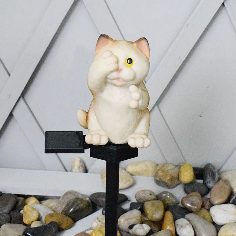 Brown or grey resin cat-shaped solar lawn light for garden and courtyard decoration.