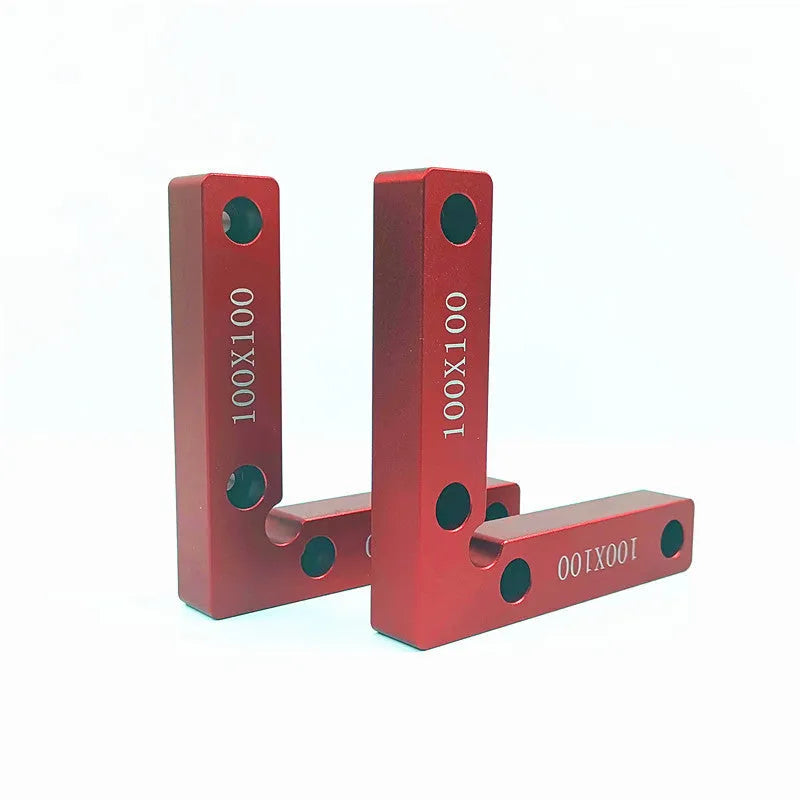 Aluminium woodworking right angle positioning block with engraved scale, shown next to a clamp.