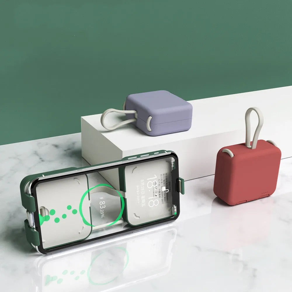 Handbag clip power bank in blue, green, red, or white with mobile phone stand functionality and dual charging ports