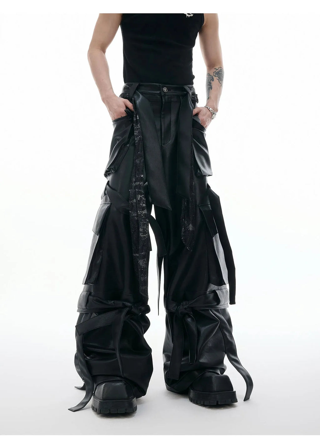 Black loose-fit men's cargo trousers with quilted panels, ribbon trim, and multiple pockets.