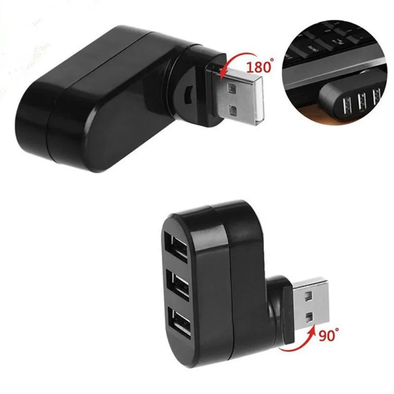 Black or white USB 2.0 four-port hub for laptop expansion on a desk.