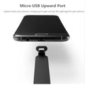 Black L-bend gaming phone charging cable with suction cup attached to a mobile phone, showing flat tangle-free design.