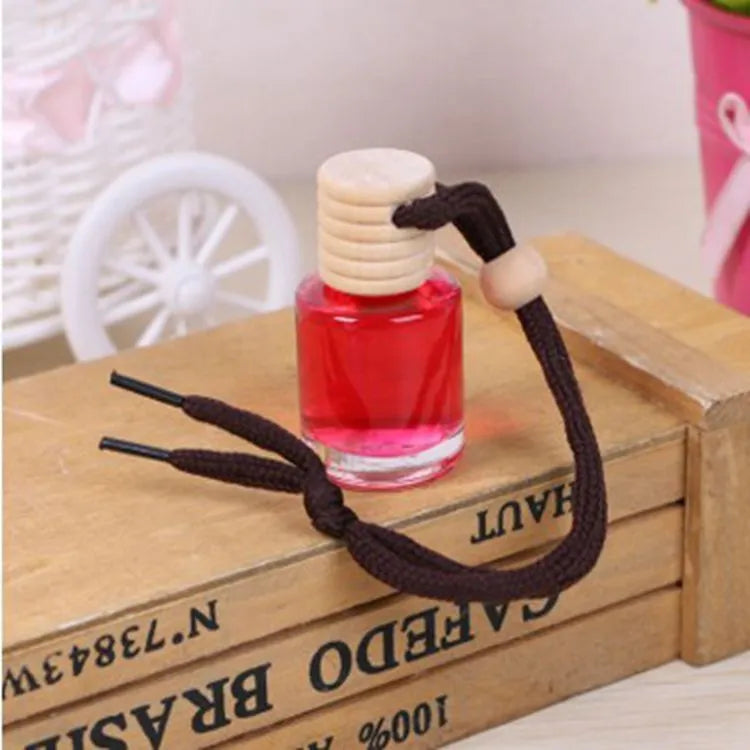 Glass bottle car air freshener hanging ornament with six fragrance options including lavender, lemon and apple scents