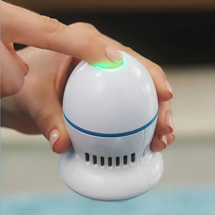 Beige and white electric foot file callus remover with two grinding heads and USB cable