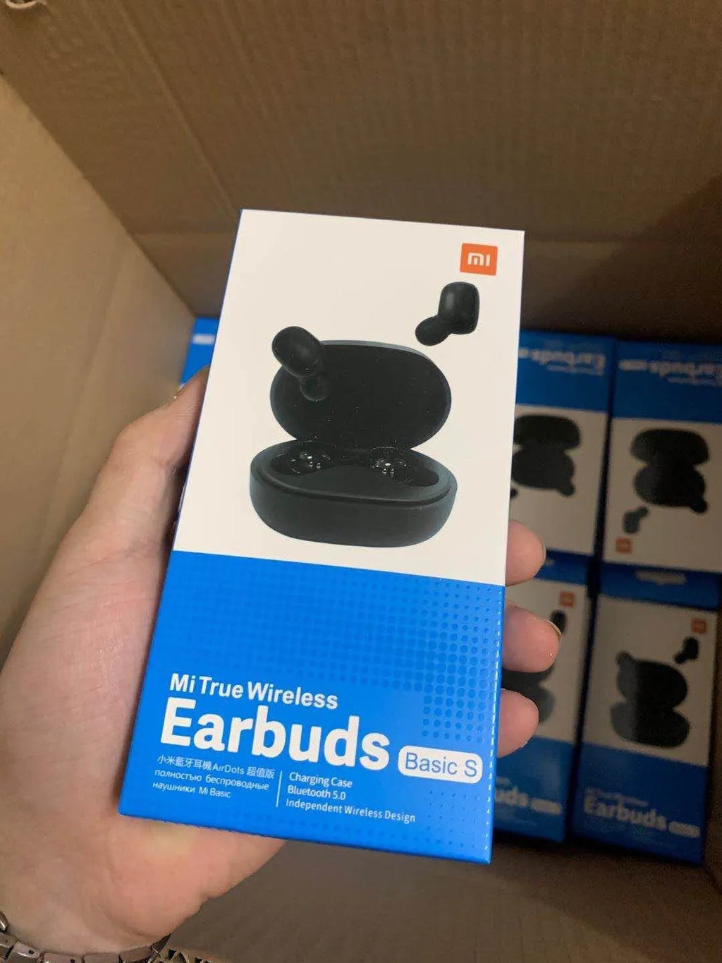 Redmi AirDots 2 black true wireless earphones and charging case on a white background.