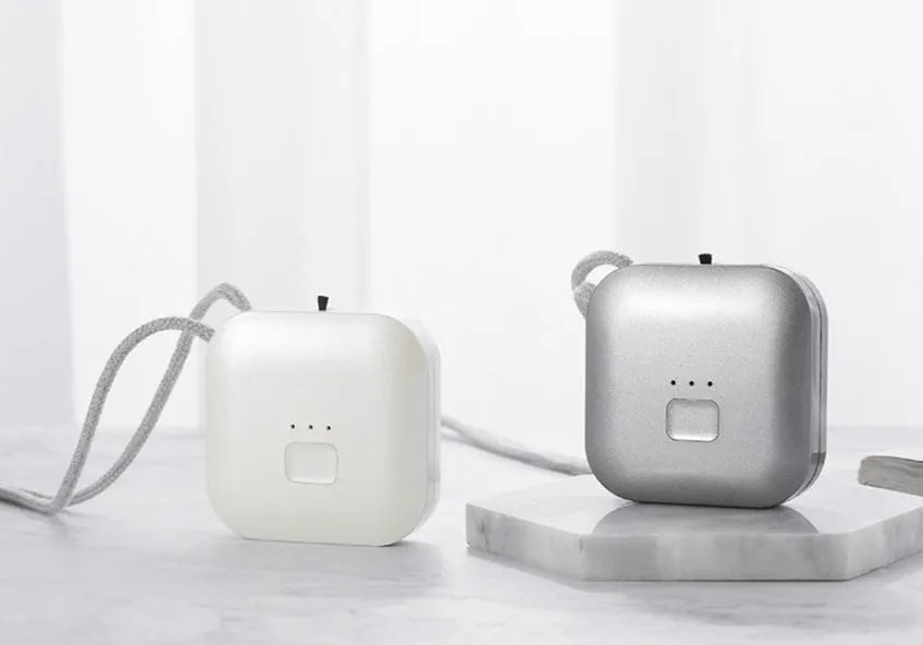 USB mini portable air purifier necklace in blue, grey, pink or white colours with charging cable