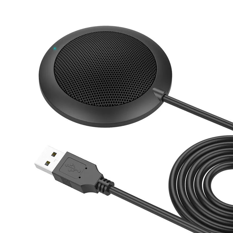 Black USB desktop microphone with metal mesh cover and zinc alloy shell on a computer desk