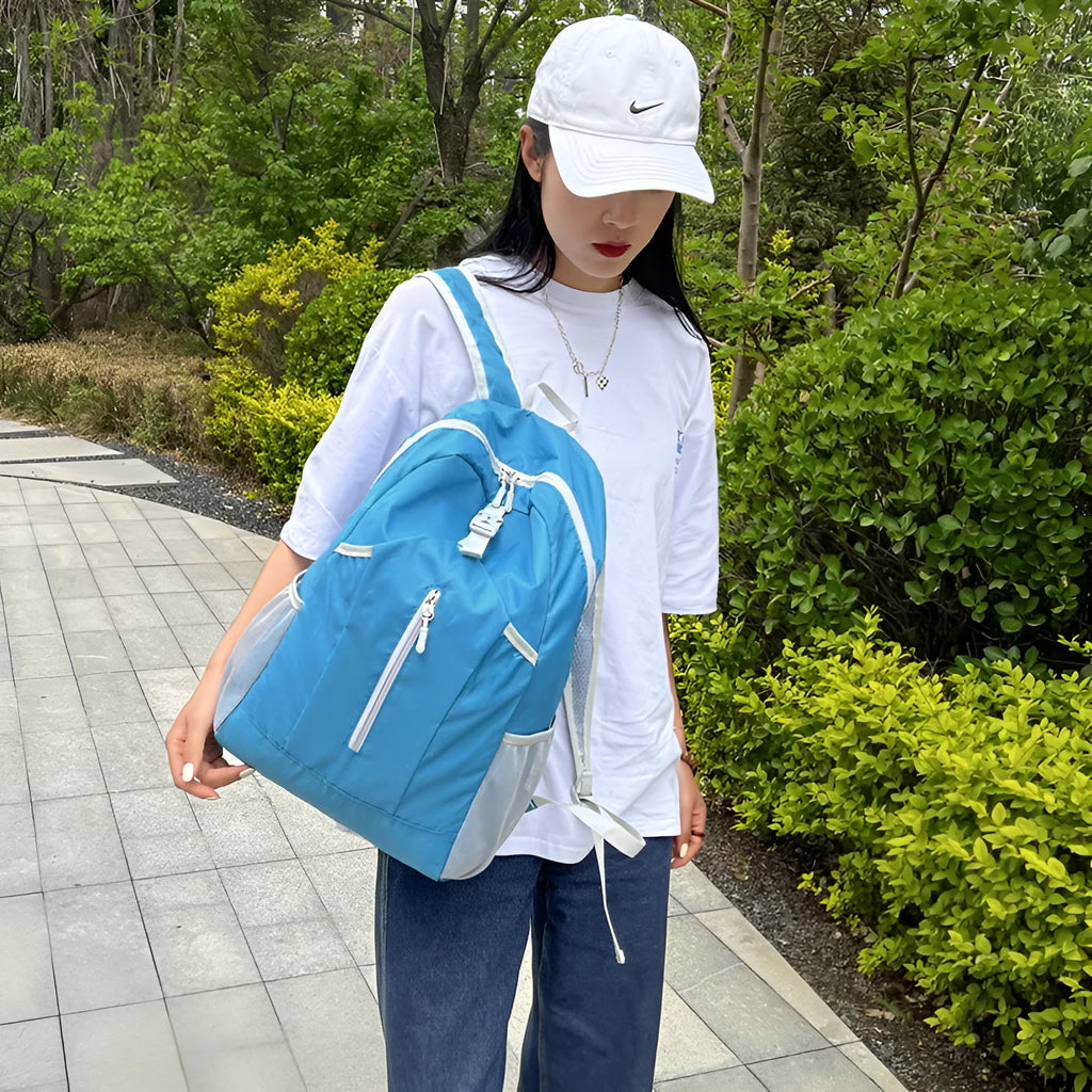 Waterproof Oxford cloth hiking backpack in blue with curved shoulder strap