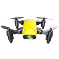 Micro foldable RC drone with 300K WiFi camera in blue, deployed on surface showing foldable arms