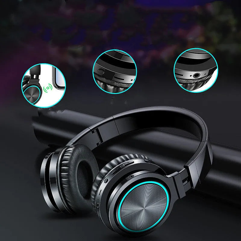 B12 wireless folding headset shown in black colour, demonstrating its folded compact state and head-mounted design.