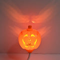 Plastic pumpkin lamp with USB charging cable showing yellow and purple light options