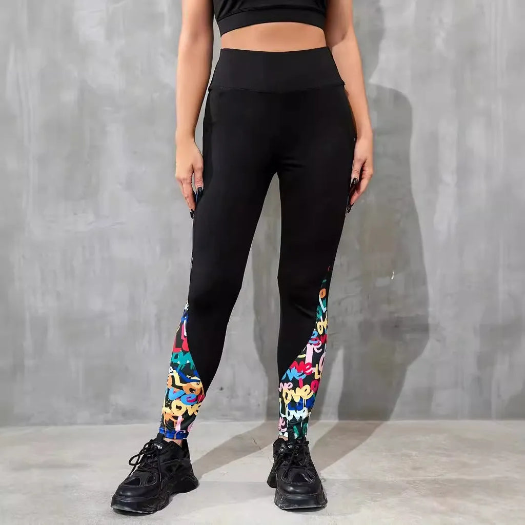 Black women's high-waist fitness leggings with colour-contrast patchwork patterns and side pockets.