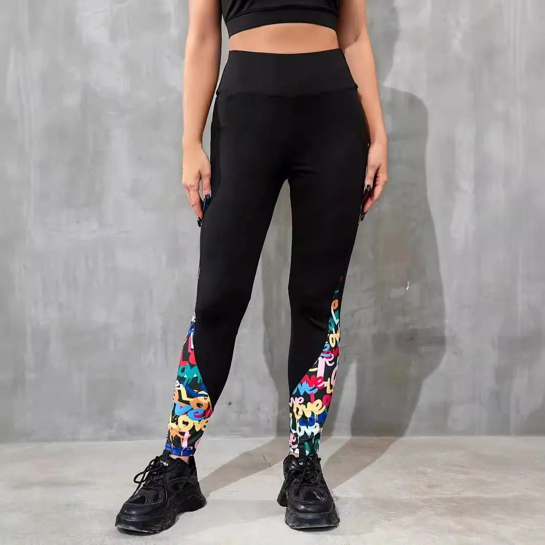 Black women's high-waist fitness leggings with colour-contrast patchwork patterns and side pockets.