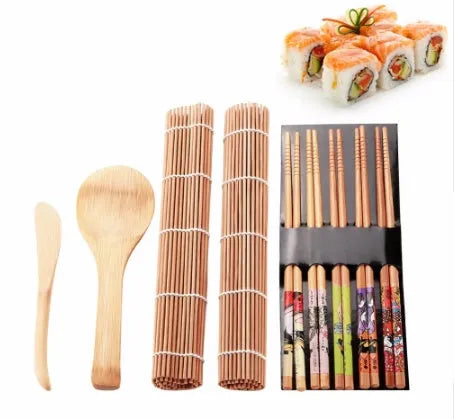 White sushi tool set with bamboo rolling mat and spatula on a kitchen counter
