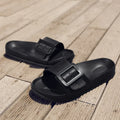 Women's grey blue buckle slipper flip-flops with a soft EVA sole on a plain background.