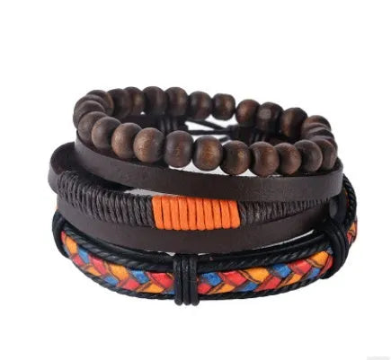 Handmade brown leather wrap bracelet with wooden beads and braided cord on a wrist.